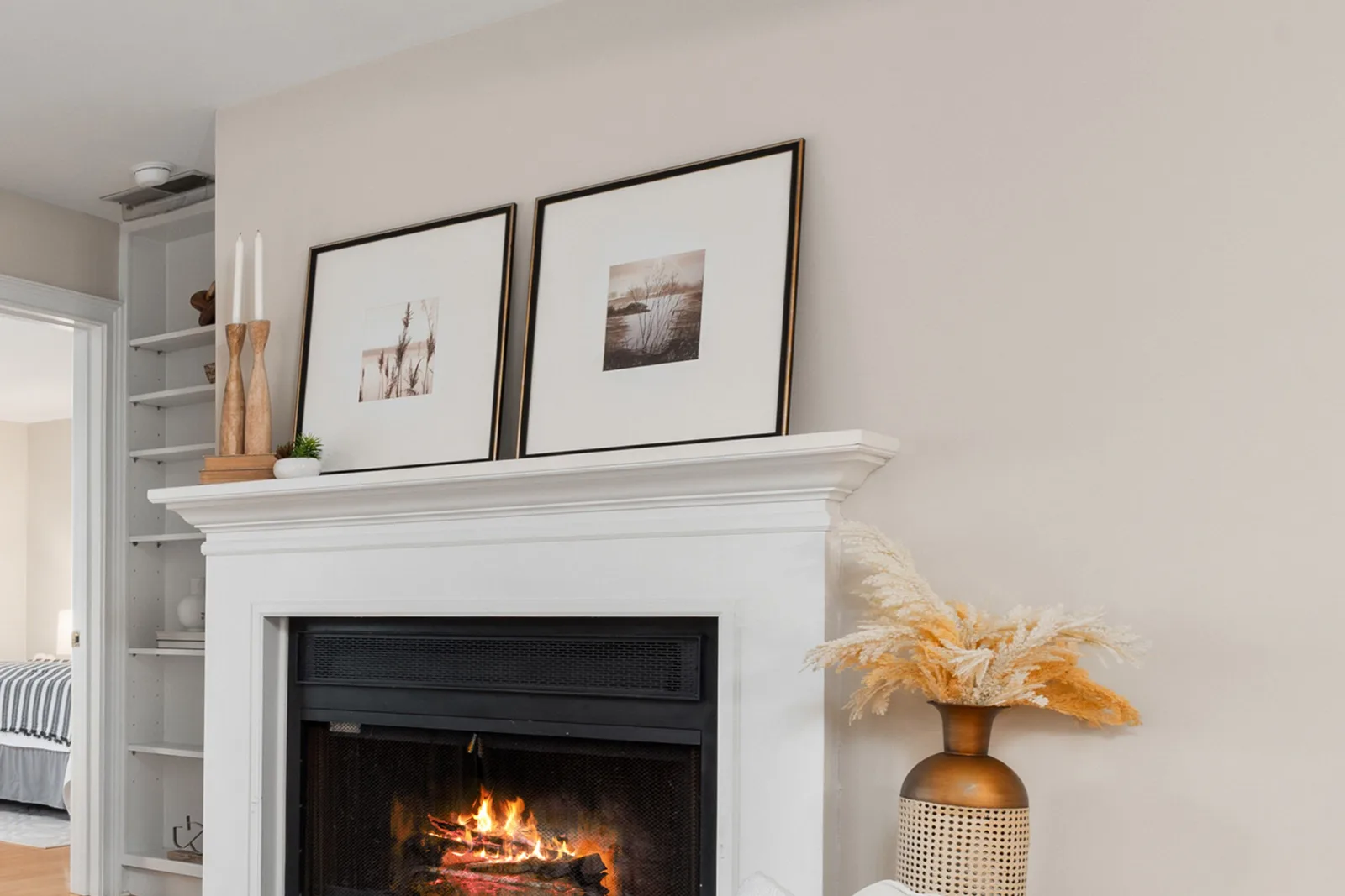 Mantel styled with framed prints in a staged home