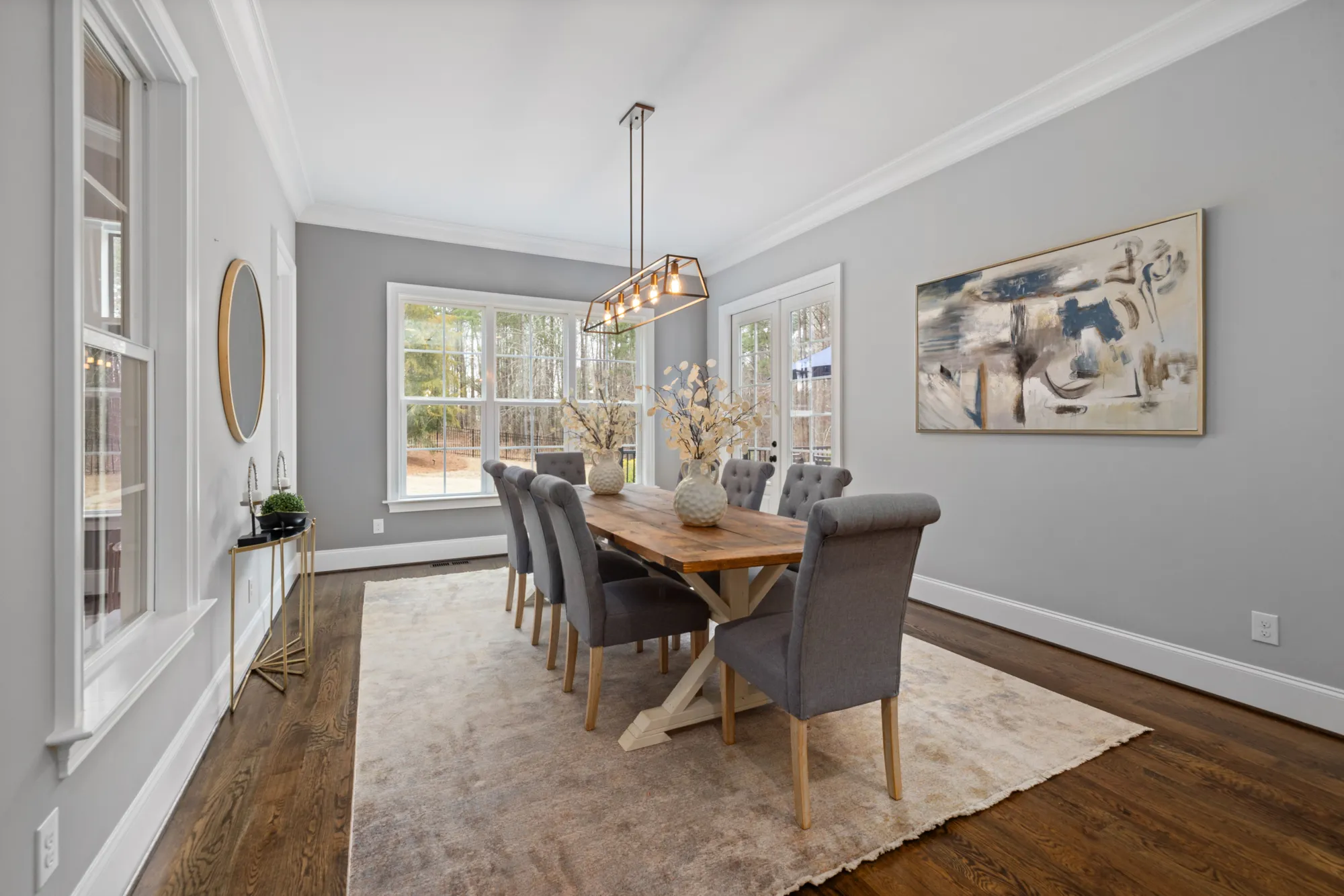 Sunlit dining room staged to lead the listing